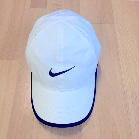 Nike women’s dry fit featherlite cap, white, never worn.